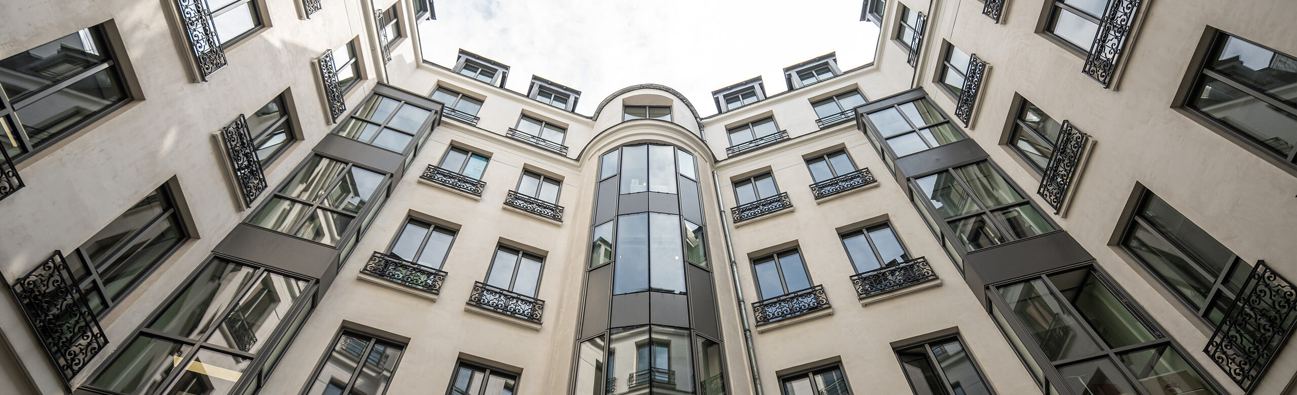 Facade of a building complex in the centre of Paris on Boulevard Haussmann.